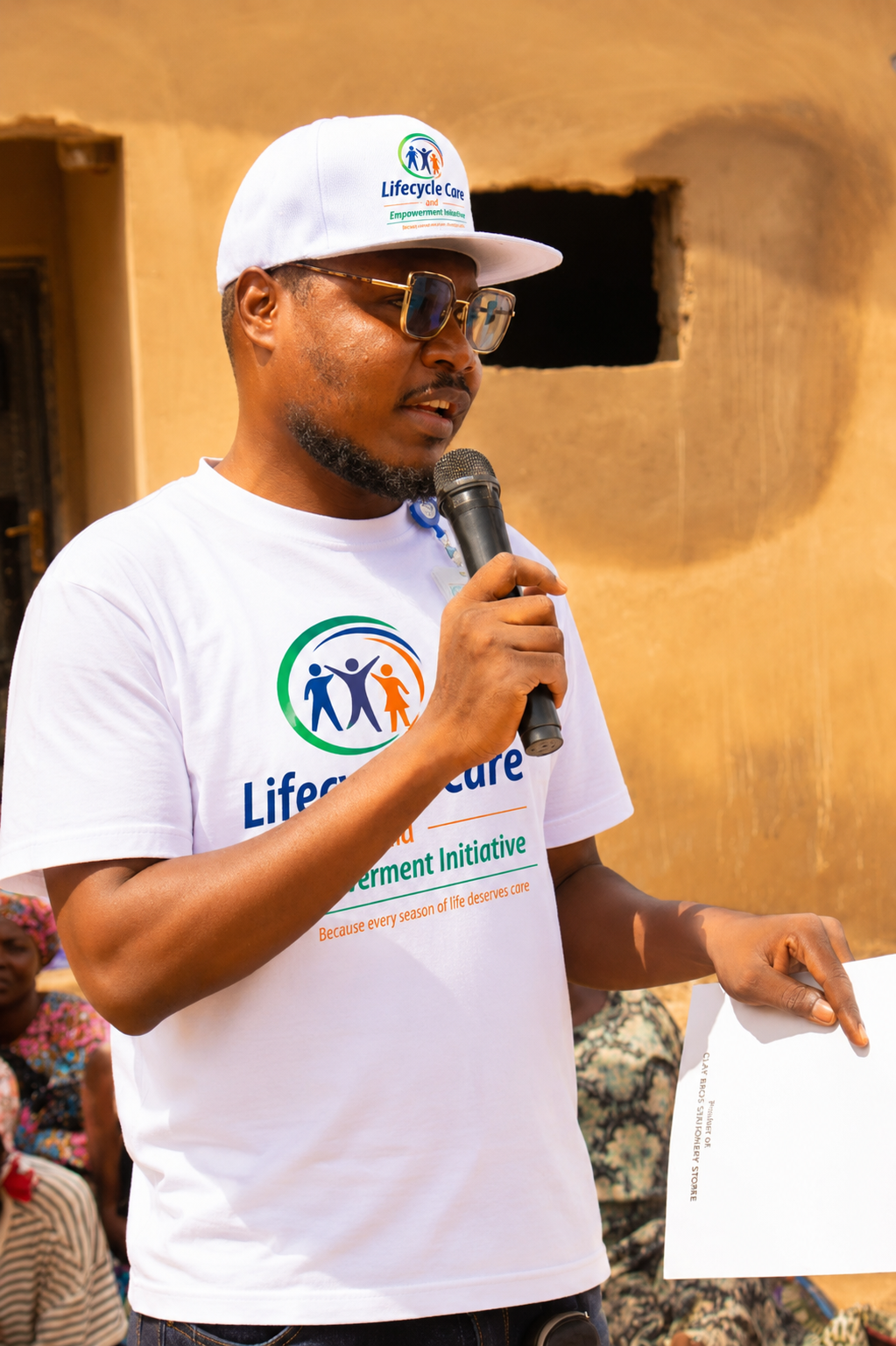Lifecycle Care team member speaking with a microphone during community outreach